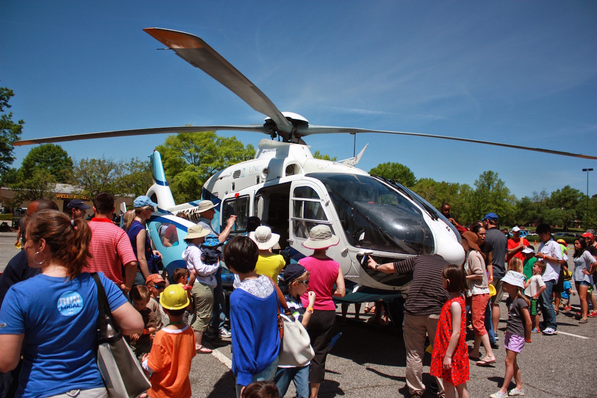 Families exploring vehicles